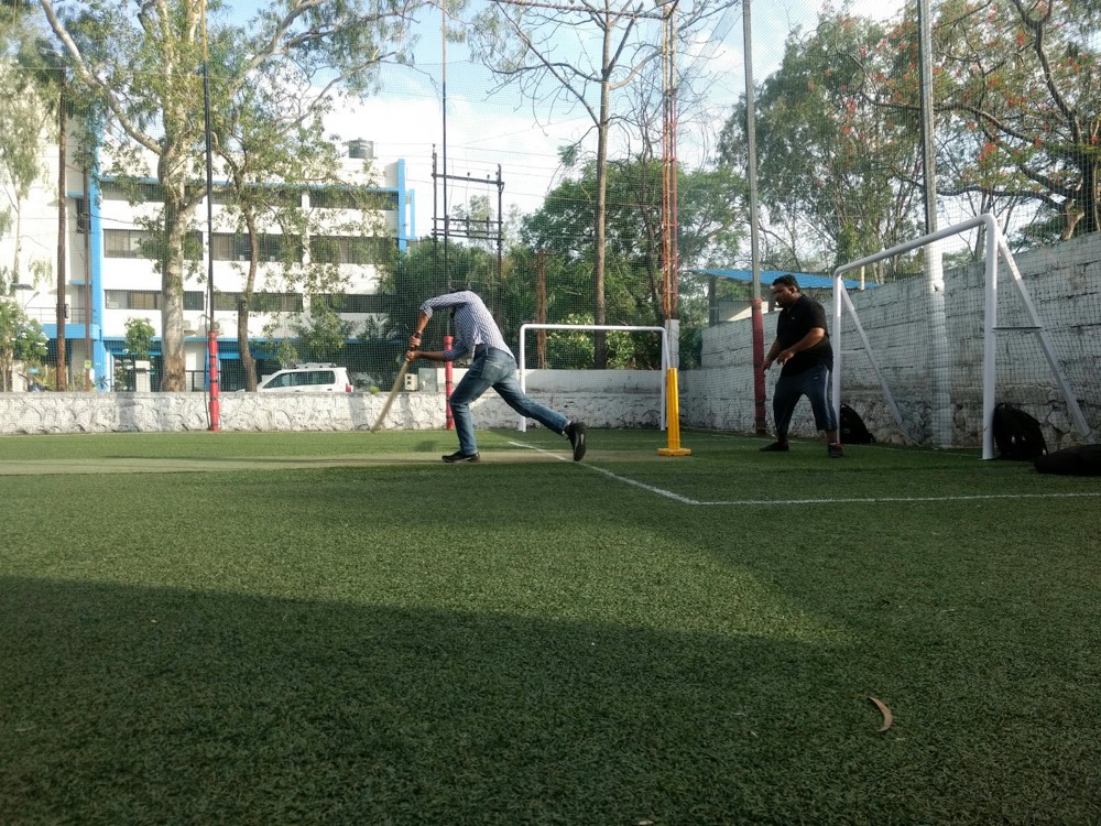 Box cricket on a netted turf