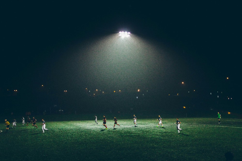 Football game under floodlights